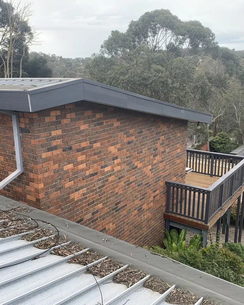 Gutter and downpipe junction detail