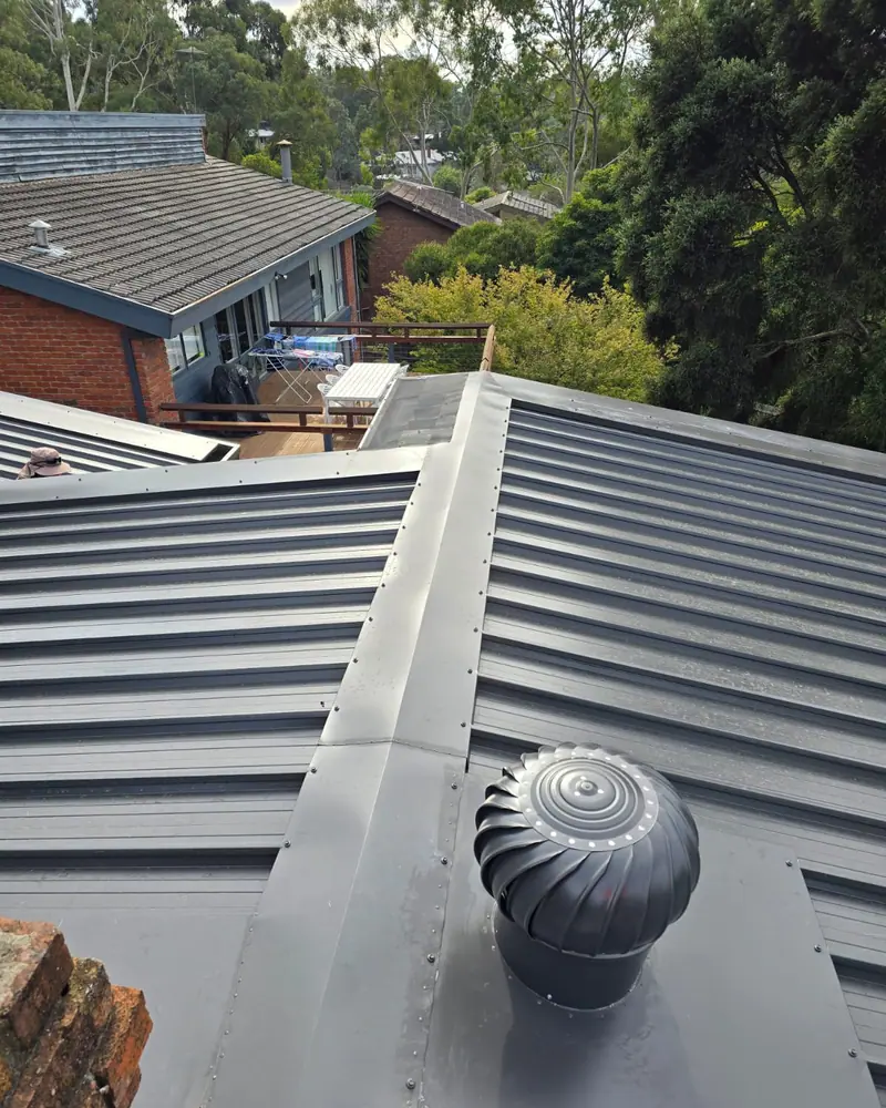 Metal roof with a whirlybird and ridge capping