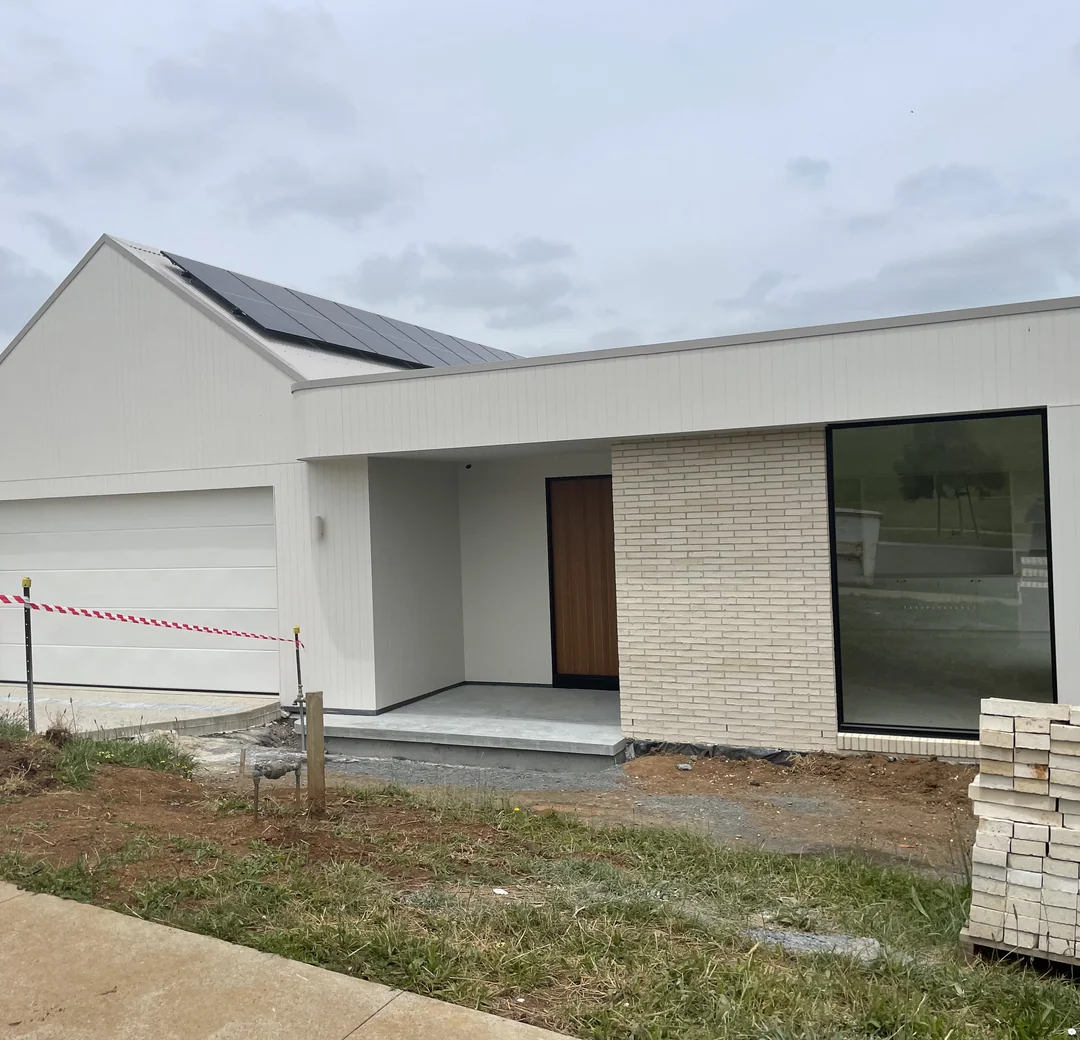Modern home exterior with a dark metal roof