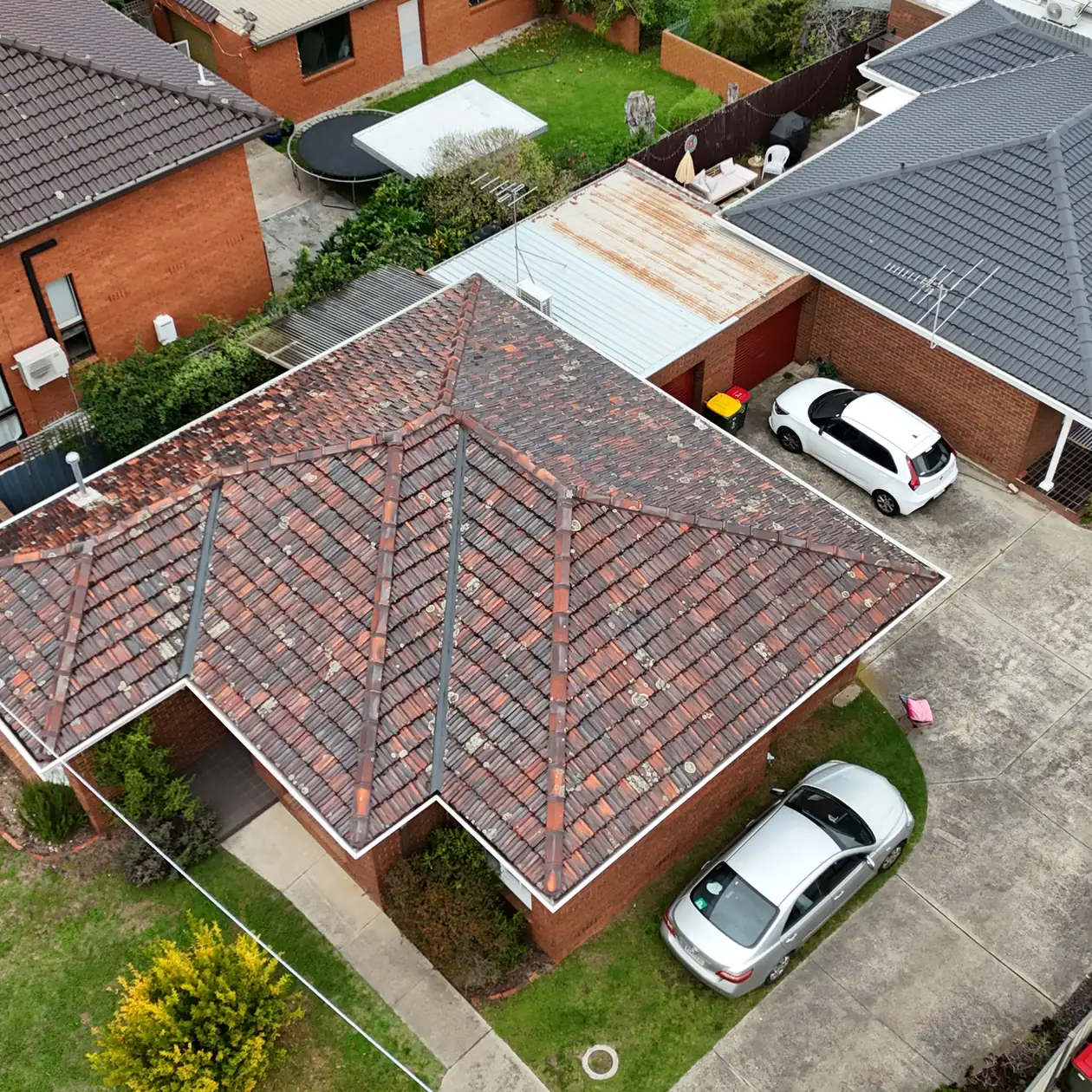 Ageing terracotta tile roof before replacement
